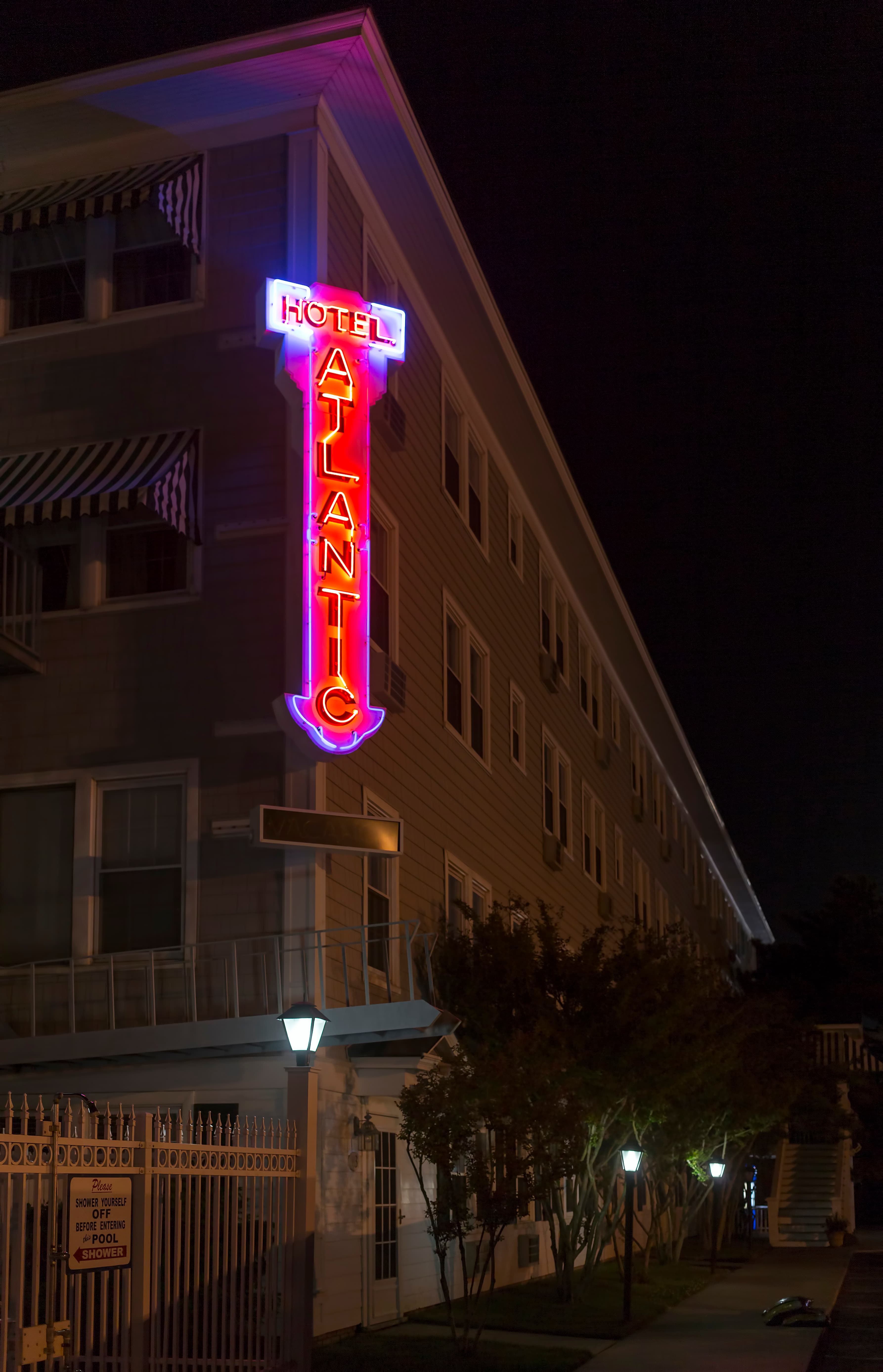The Atlantic Hotel's pale façade and balconies facing Baltimore Avenue in Ocean City.