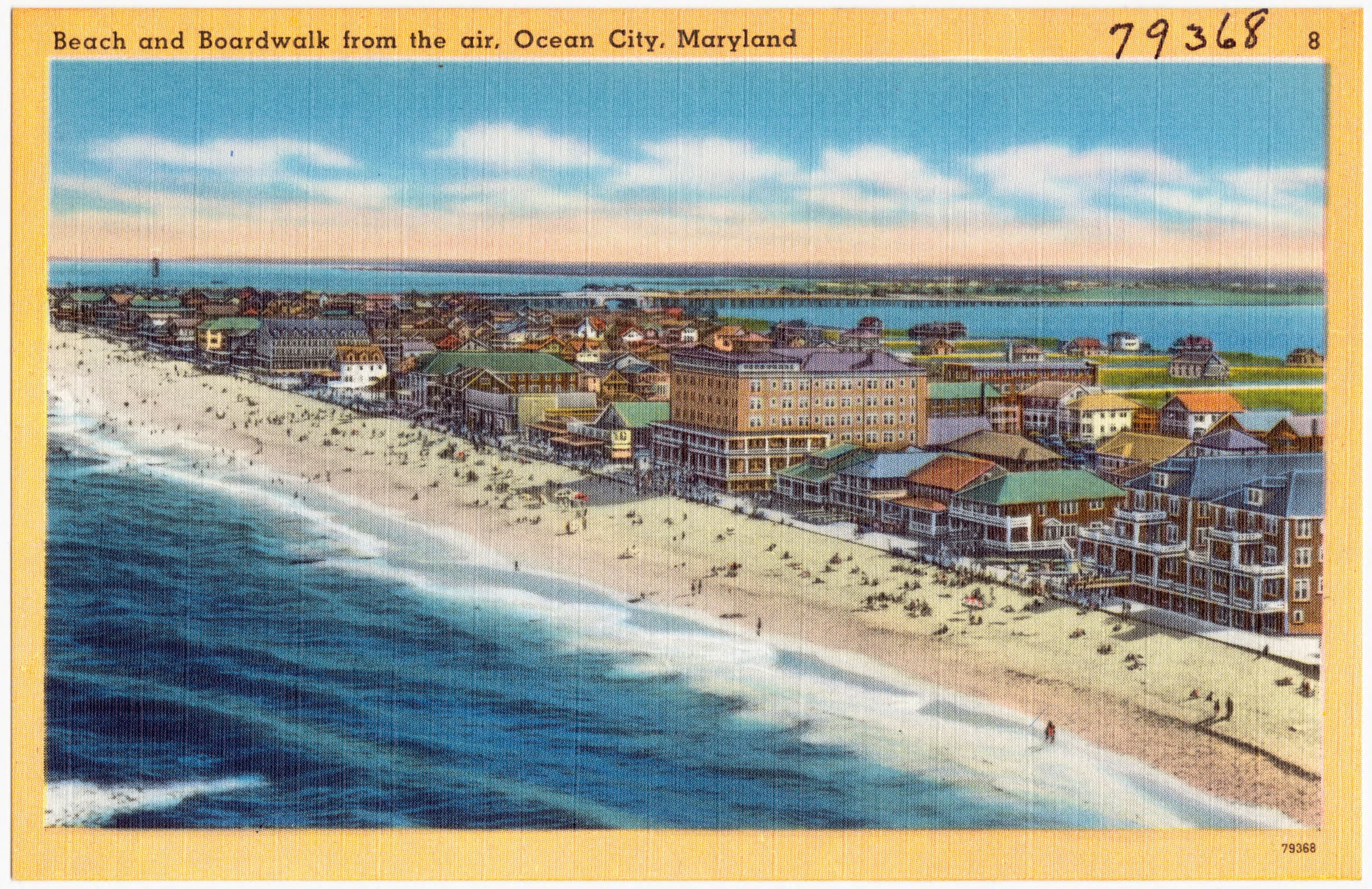 Color postcard aerial looking along Ocean City's beach and early Boardwalk development.