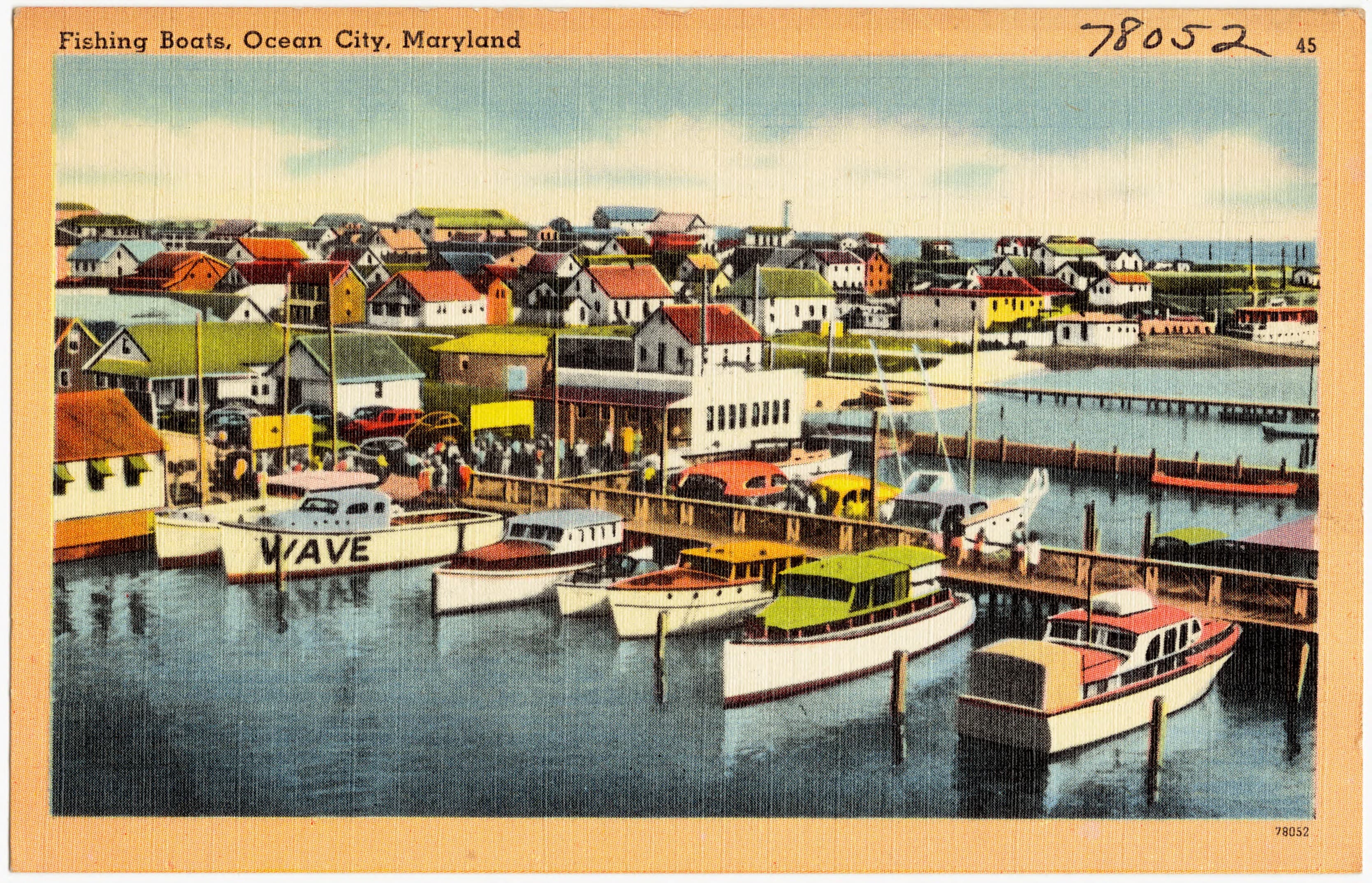 Vintage color postcard of fishing boats moored along Ocean City's working harbor.