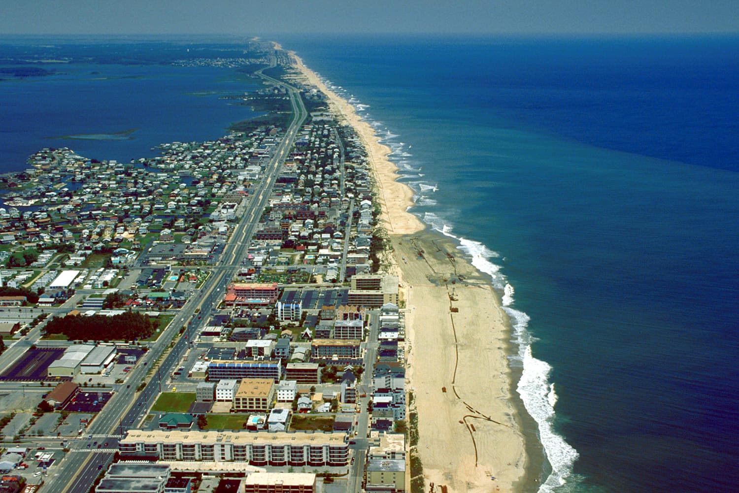 Aerial view north along Ocean City's narrow barrier island between the Atlantic and coastal bays.