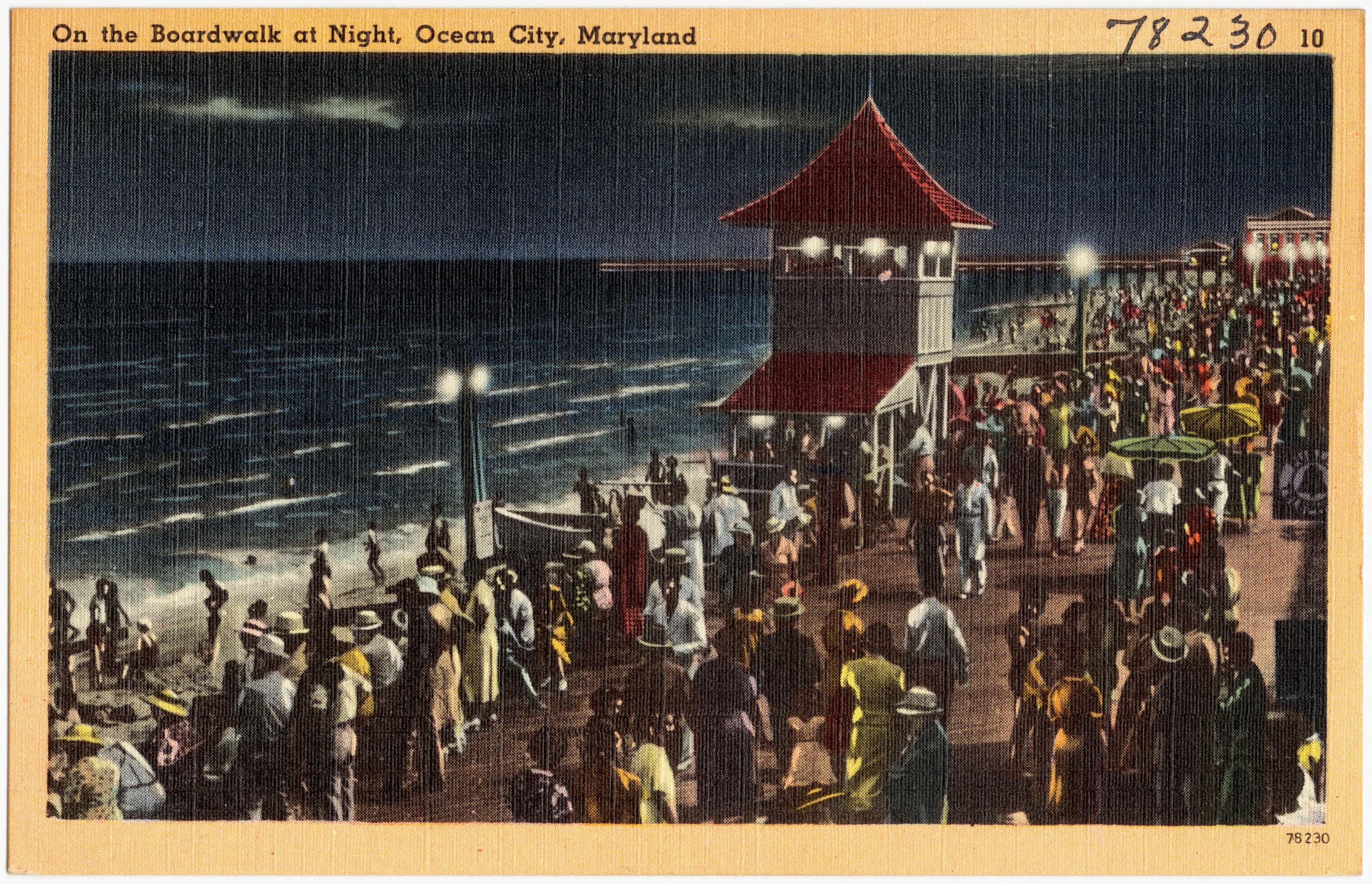 Vintage color postcard showing Ocean City's illuminated Boardwalk at night.